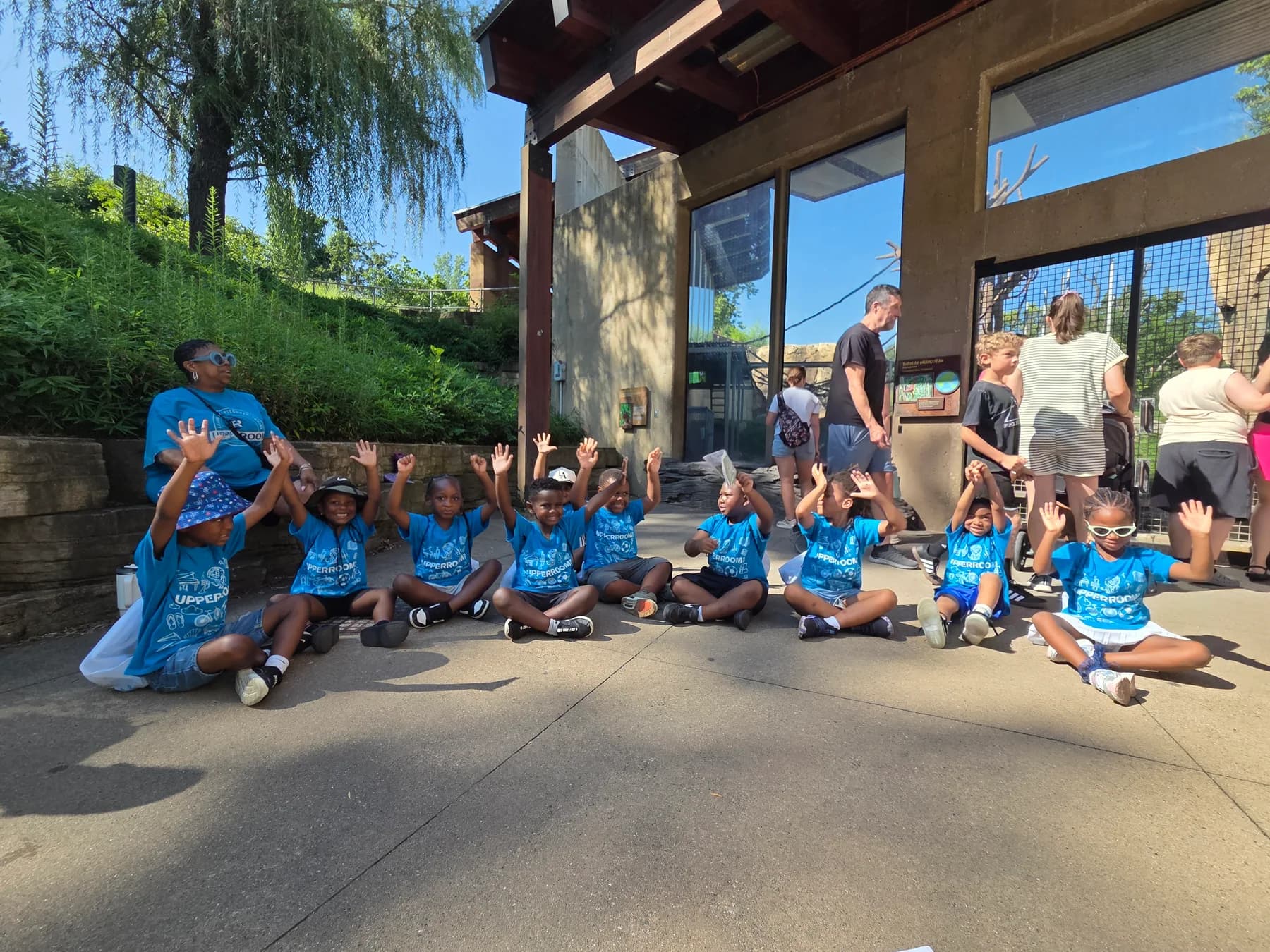 Children gathered for a community activity at the zoo