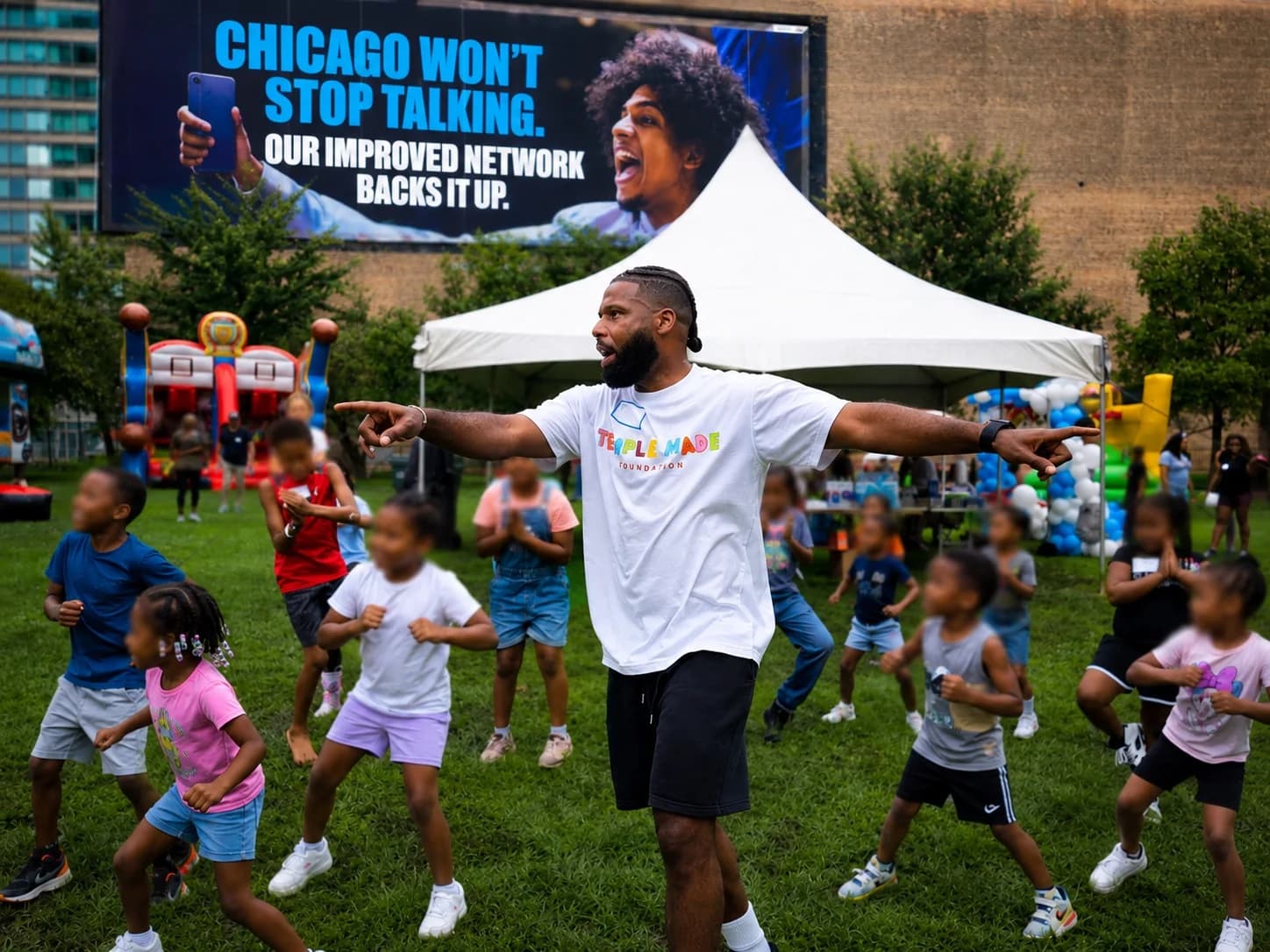 Children participating in an outdoor movement activity with a Temple Made Foundation coach in Chicago