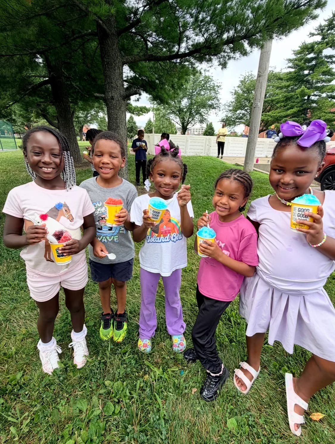 Children celebrating together during an outdoor Read and Move It activity